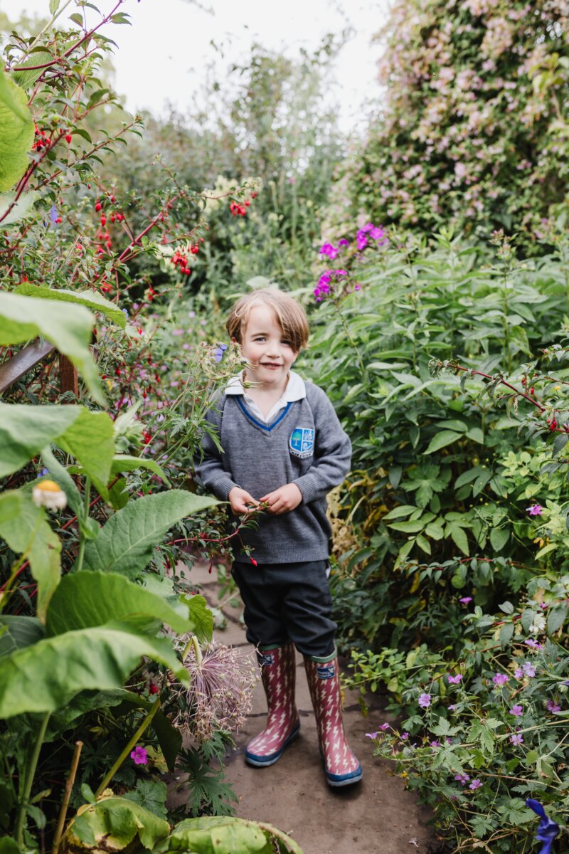 Child in the garden by Rebecca Brooker 